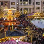 People enjoying food at an outdoor Christmas market, symbolizing holiday dining needs when searching for 'fast food restaurants near me open now'.