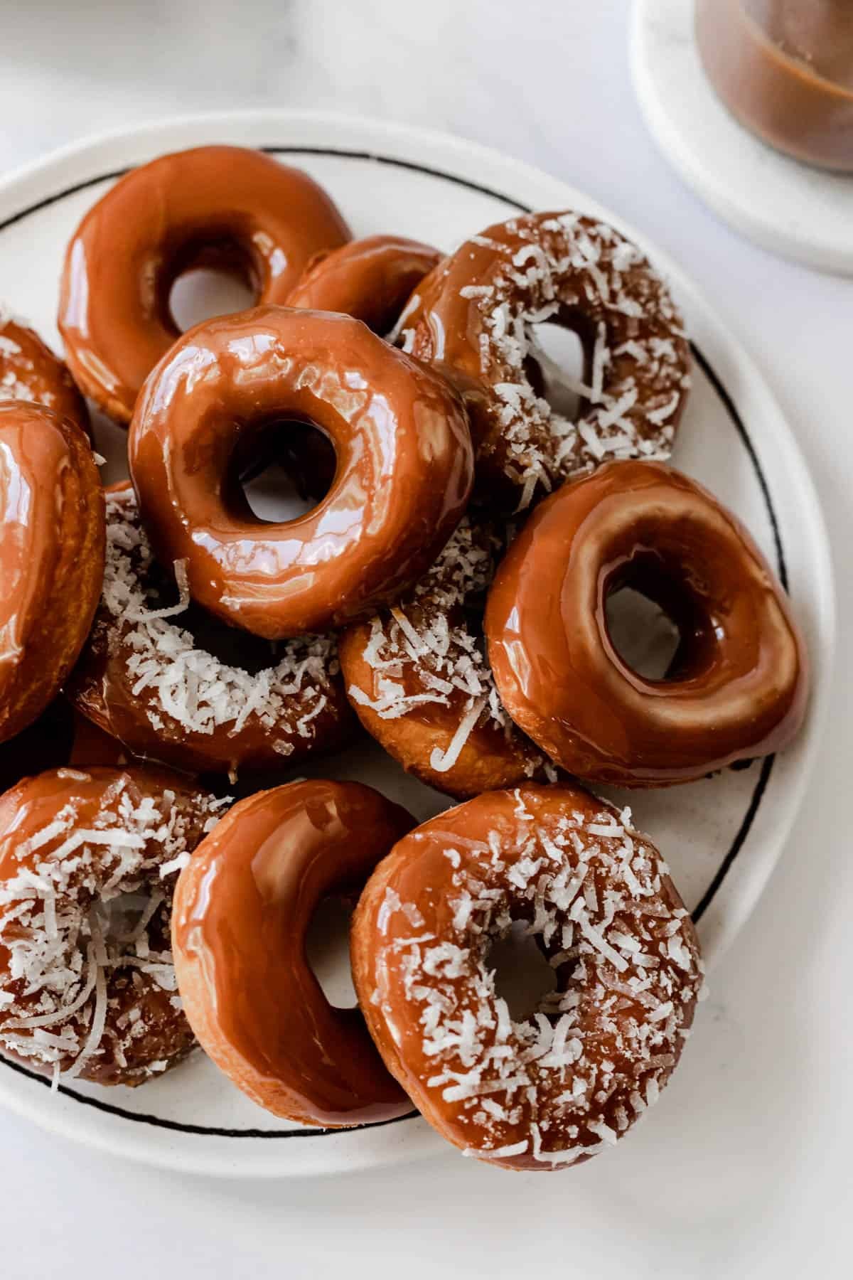 Plate of donetes, Cape Verde food style mini donuts, topped with caramel and coconut