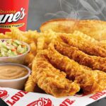 Raising Cane's fast food box combo meal deal featuring chicken fingers, fries, and toast.