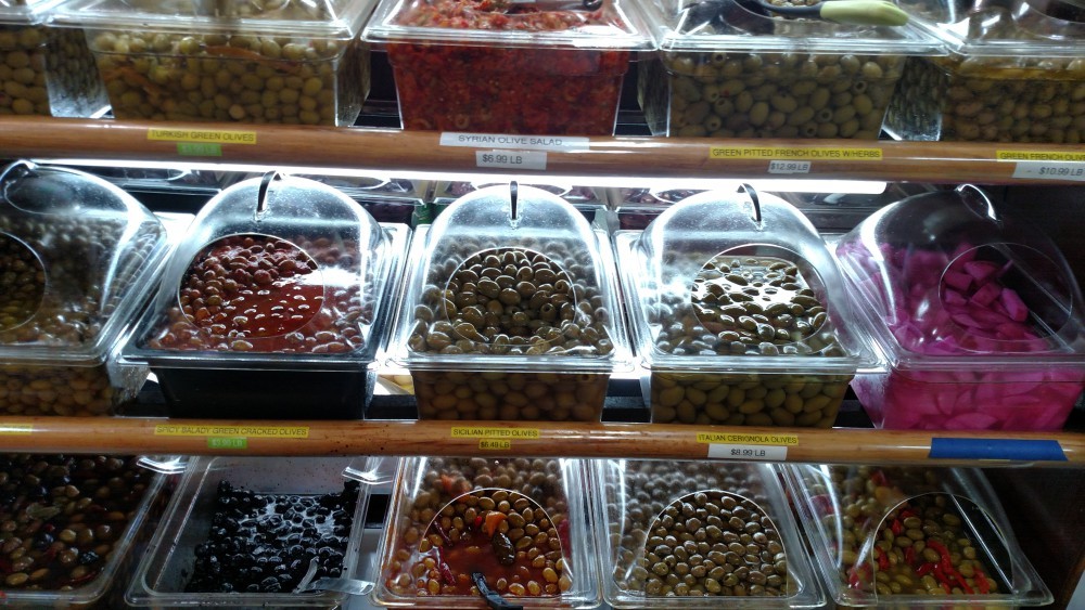 Selection of olives at Balady Halal Market showcasing variety and freshness