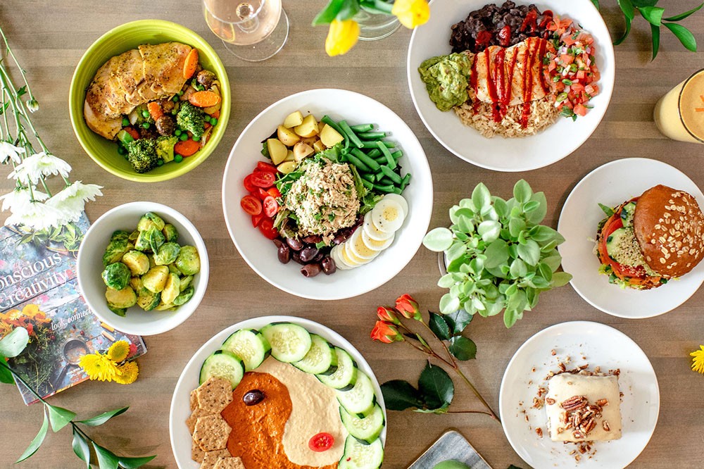 Stylish interior of Enjoy Pure Food + Drink restaurant in Kansas City, highlighting the commitment to healthy dining.