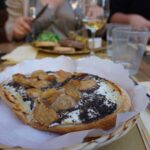 Truffle and porcini crostone paired with sparkling wine at Fuori Porta enoteca, Florence