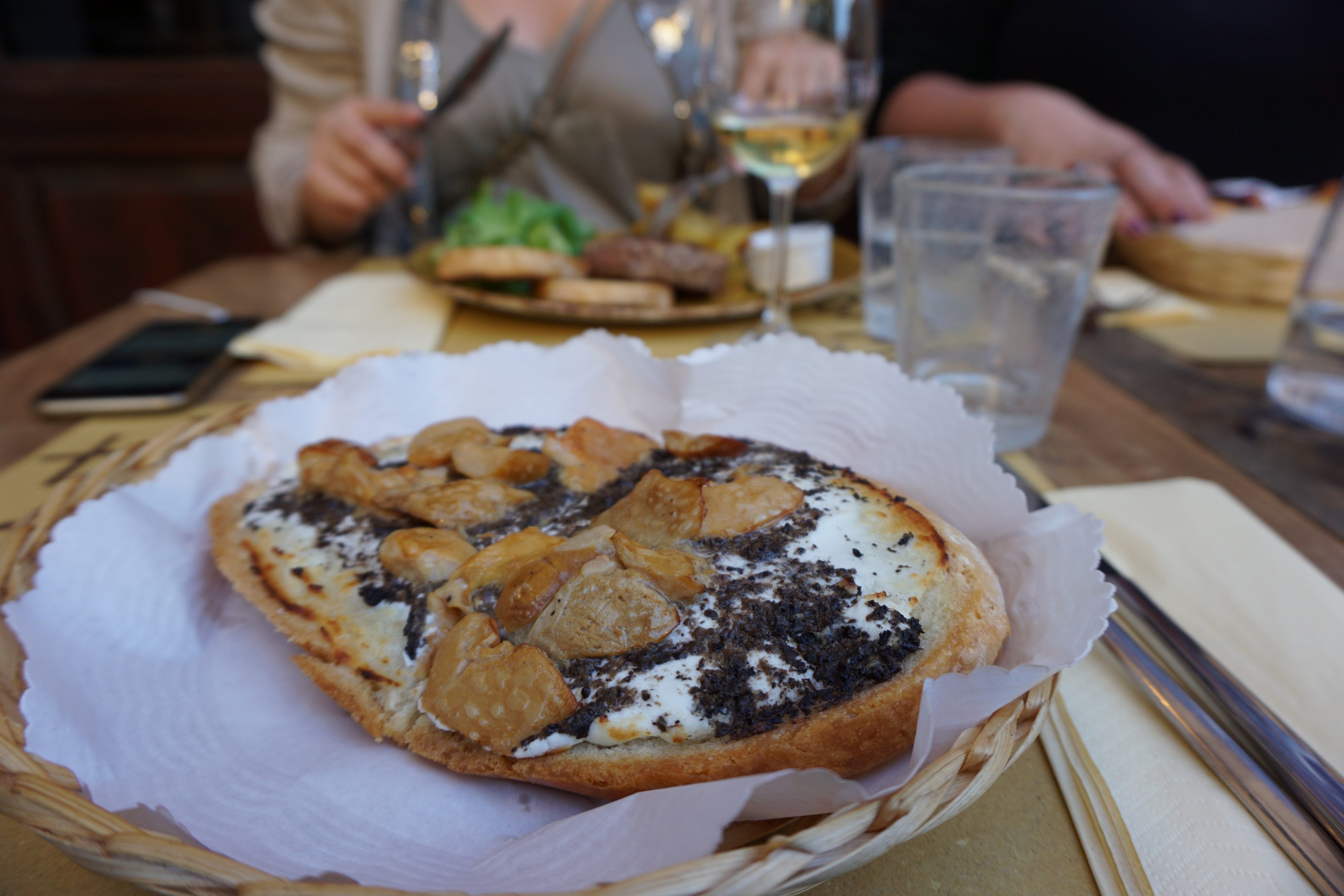 Truffle and porcini crostone paired with sparkling wine at Fuori Porta enoteca, Florence