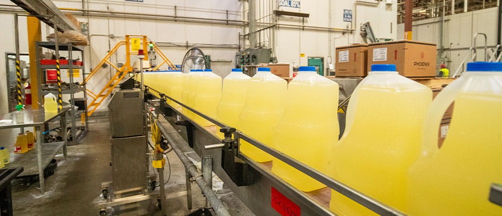 Ventura Foods Frying Oil Production: Bottles of cooking oil ready for shipment at the Ontario, California plant, highlighting Ventura Foods' role in the food industry.