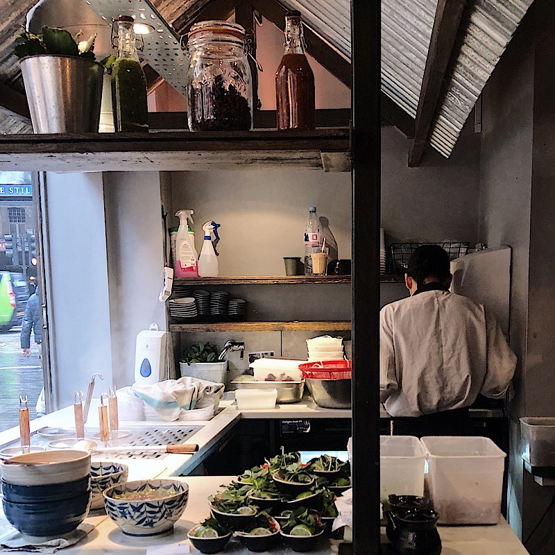 Viet Food restaurant in London's Chinatown features an open kitchen where diners can watch Vietnamese food being prepared.