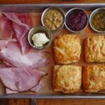 Virginia Ham and Biscuits at Founding Farmers, showcasing fresh biscuits and local ham, exemplifying good food in washington dc.