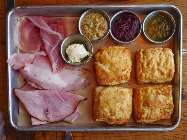 Virginia Ham and Biscuits at Founding Farmers, showcasing fresh biscuits and local ham, exemplifying good food in washington dc.