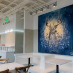 Wall painting of a buck symbolizing Buckhead heritage at Cultivate restaurant in Atlanta