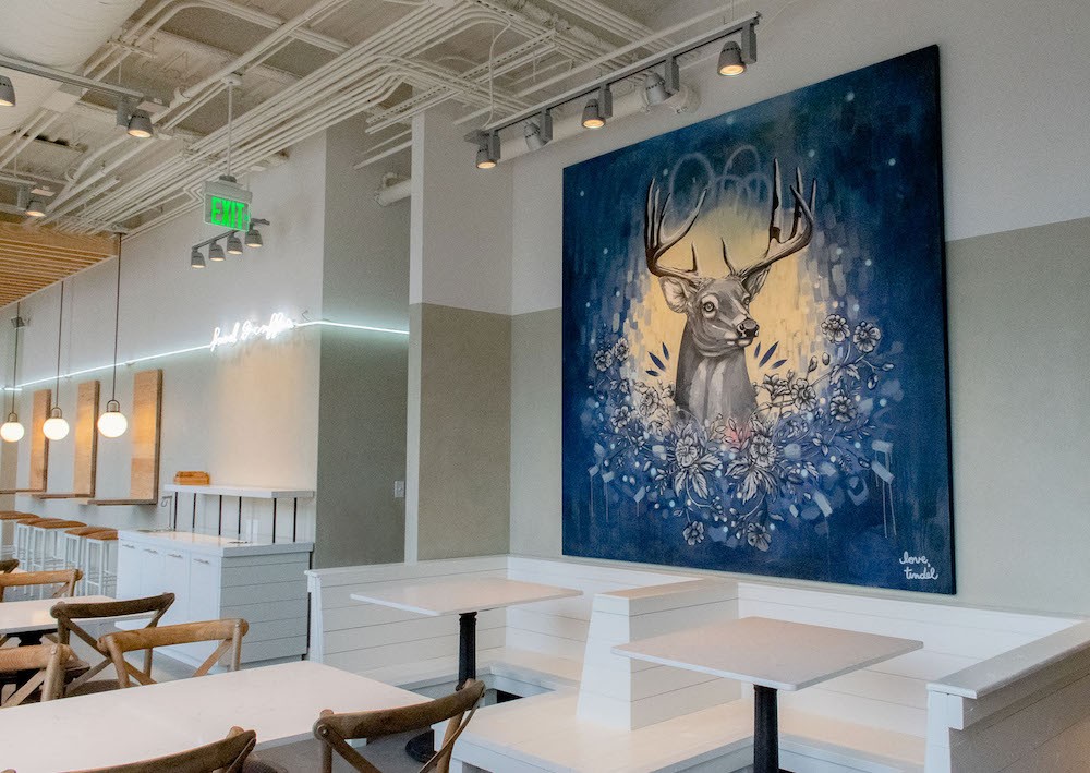 Wall painting of a buck symbolizing Buckhead heritage at Cultivate restaurant in Atlanta