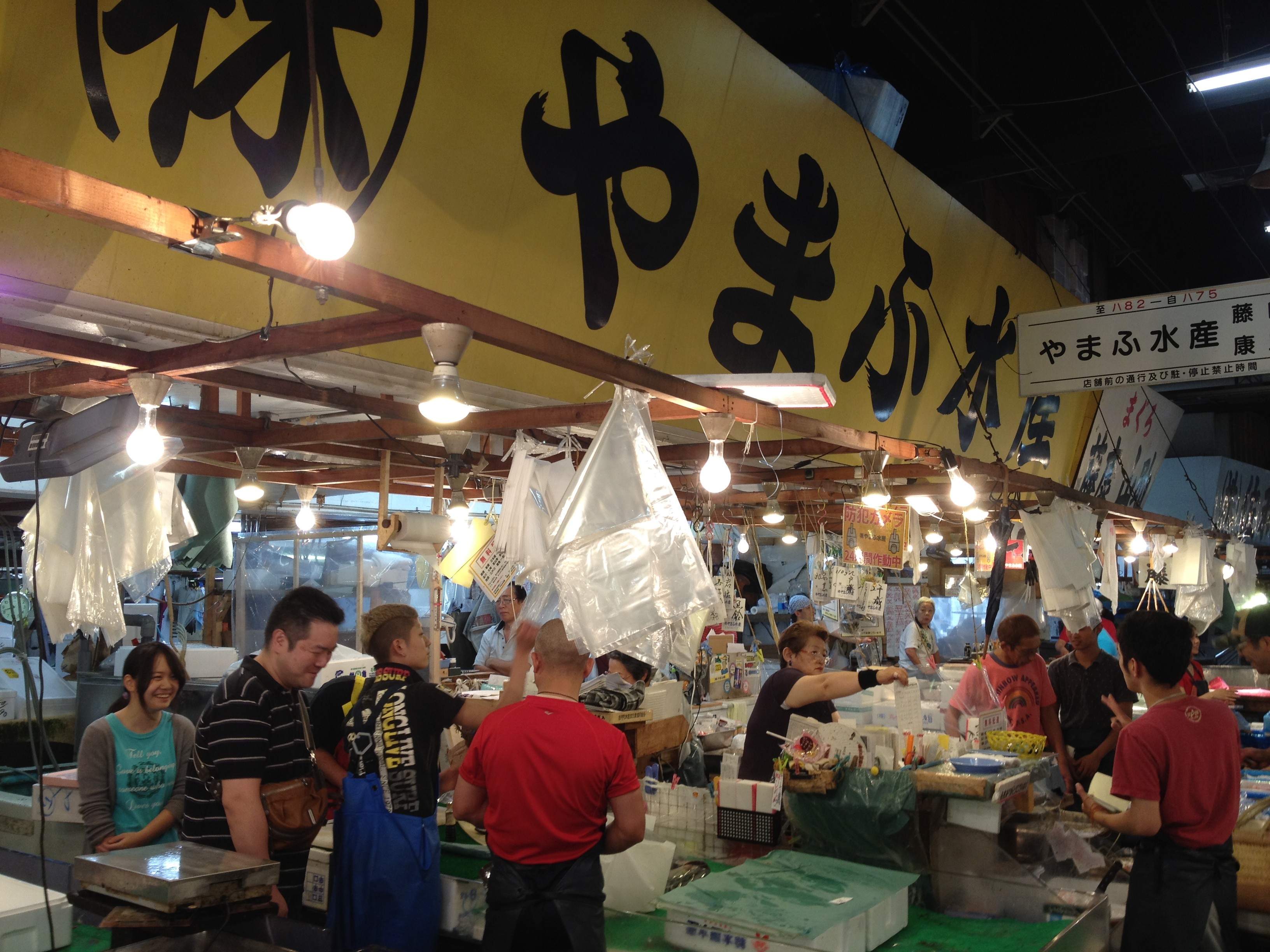 Wholesale activity at Tsukiji Fish Market showcasing the bustling trade of fresh seafood.