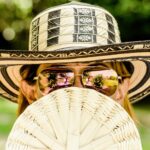 Woman wearing many hats representing work-life balance challenges