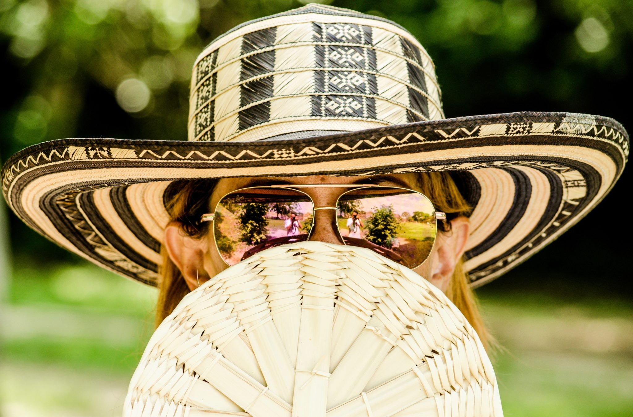 Woman wearing many hats representing work-life balance challenges