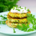 Zucchini fritters on a plate.