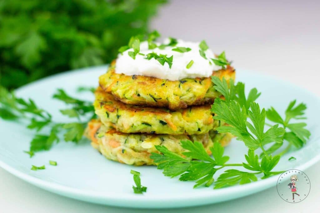 Zucchini fritters on a plate.