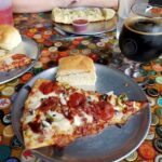 Assortment of pizzas at a local pizzeria in Lincoln, Nebraska, showcasing various toppings and crust styles