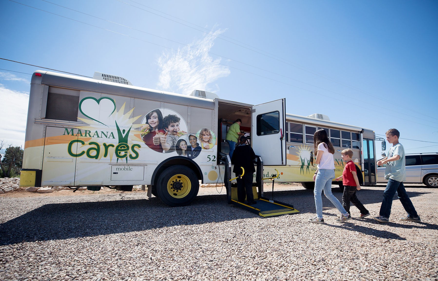 Volunteers distributing fresh fruit at an Interfaith Community Services food bank