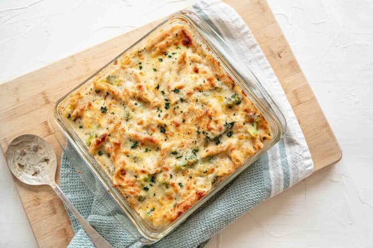 Chicken broccoli alfredo bake in a baking dish straight from the oven.