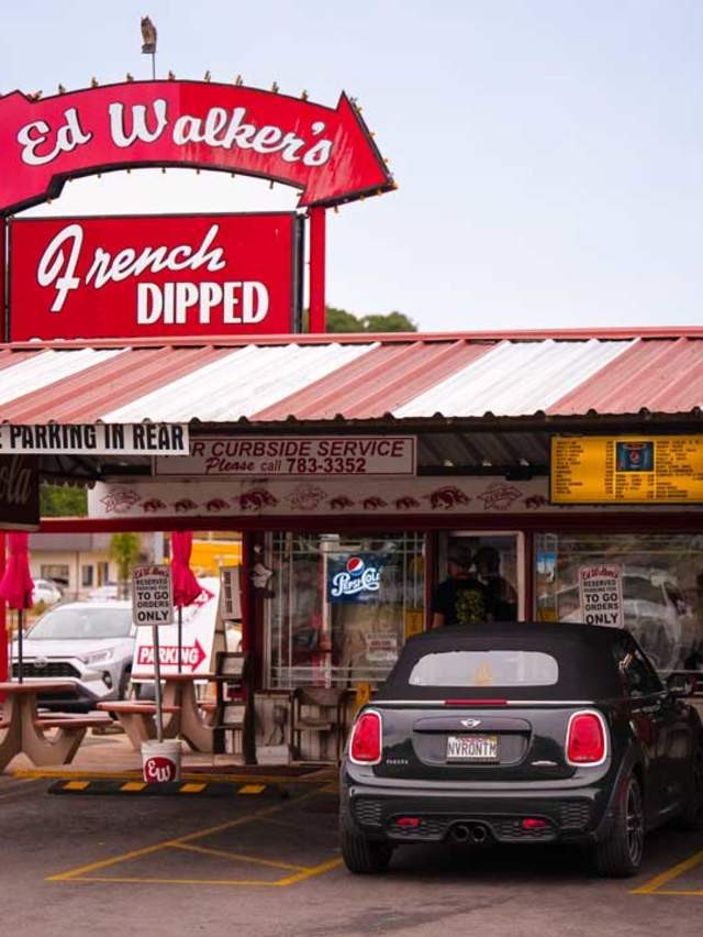 A close-up of a juicy hamburger with lettuce and tomato served at Ed Walker's Drive-In, Fort Smith.