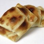 Empanadas de pino, traditional Chilean baked turnover pies with meat and onion filling