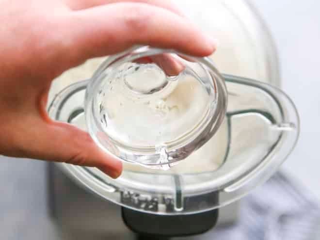 Adding ice water to a food processor