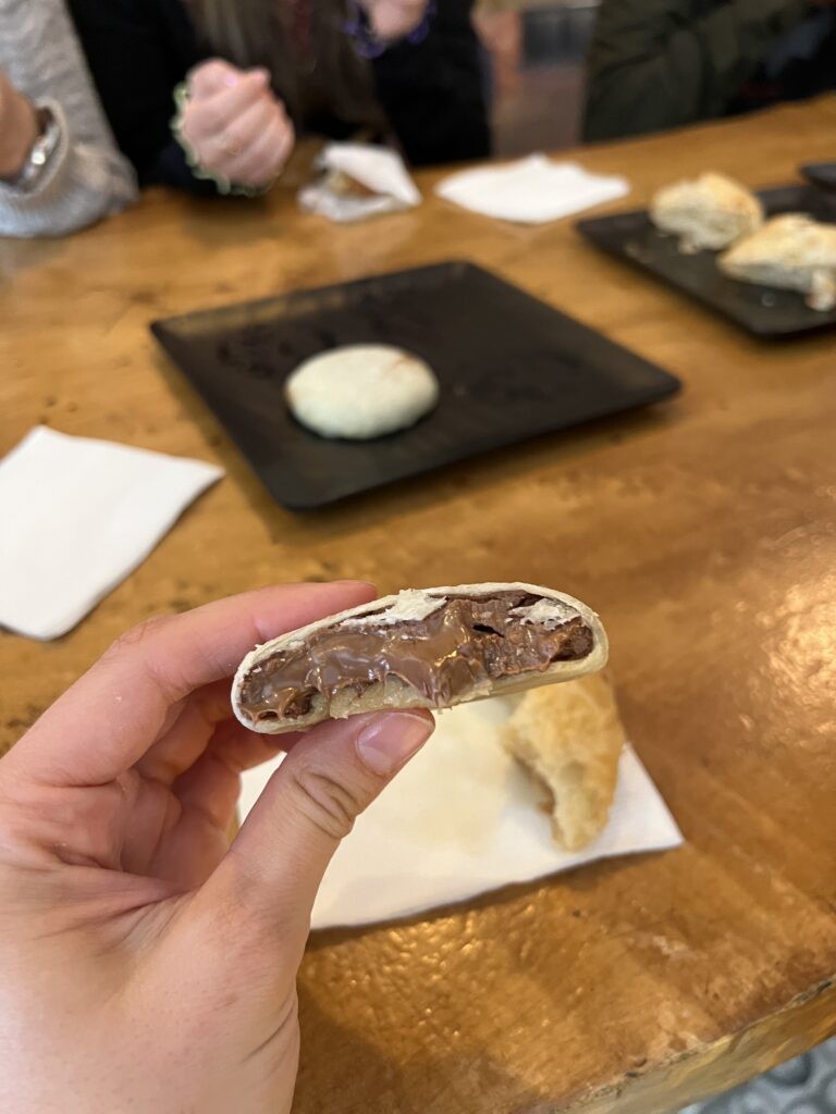 A close-up of İzmir Bomb Kurabiye, a stuffed cookie filled with a praline spread similar to Nutella