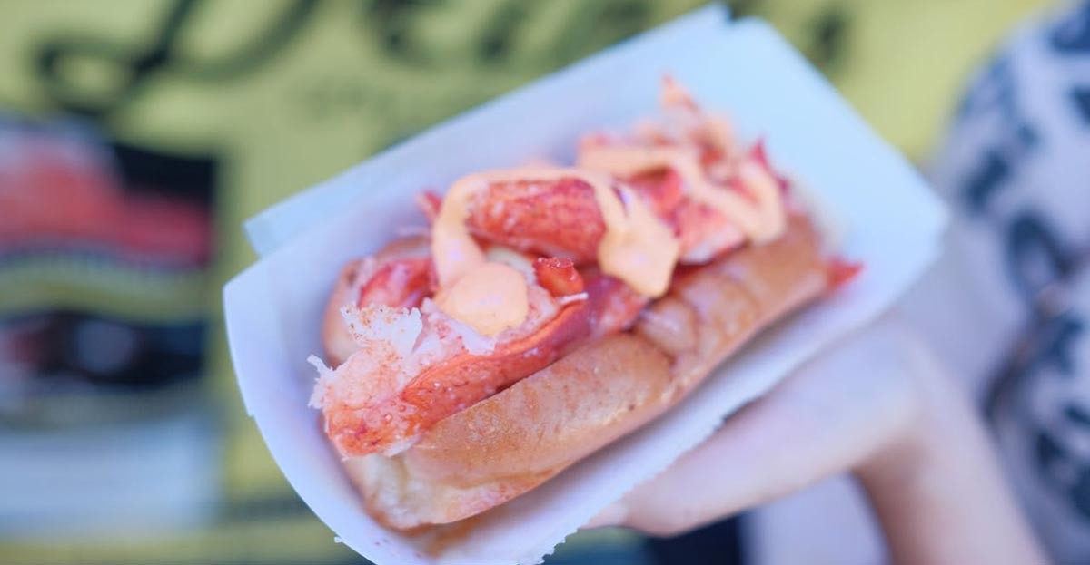 A classic Maine lobster roll, showcasing the fresh flavor of Maine lobster.