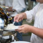 Portioned rice being cooled in shallow containers