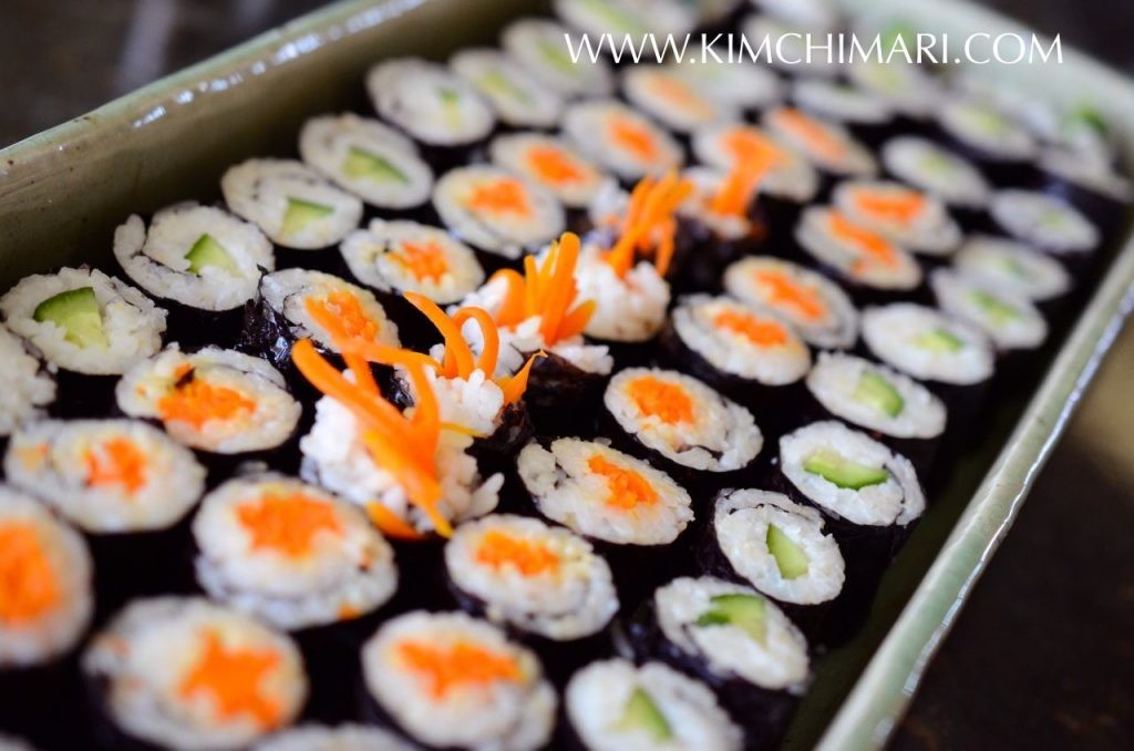 Variety of Mini Kimbap with carrots and cucumbers