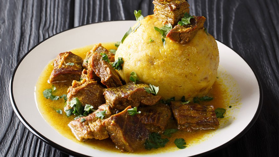 Dominican Mofongo dish with mashed plantains, garlic, and pork rinds. Alt text: Mofongo, a savory Dominican dish, showcasing mashed plantains with garlic and crispy pork cracklings.