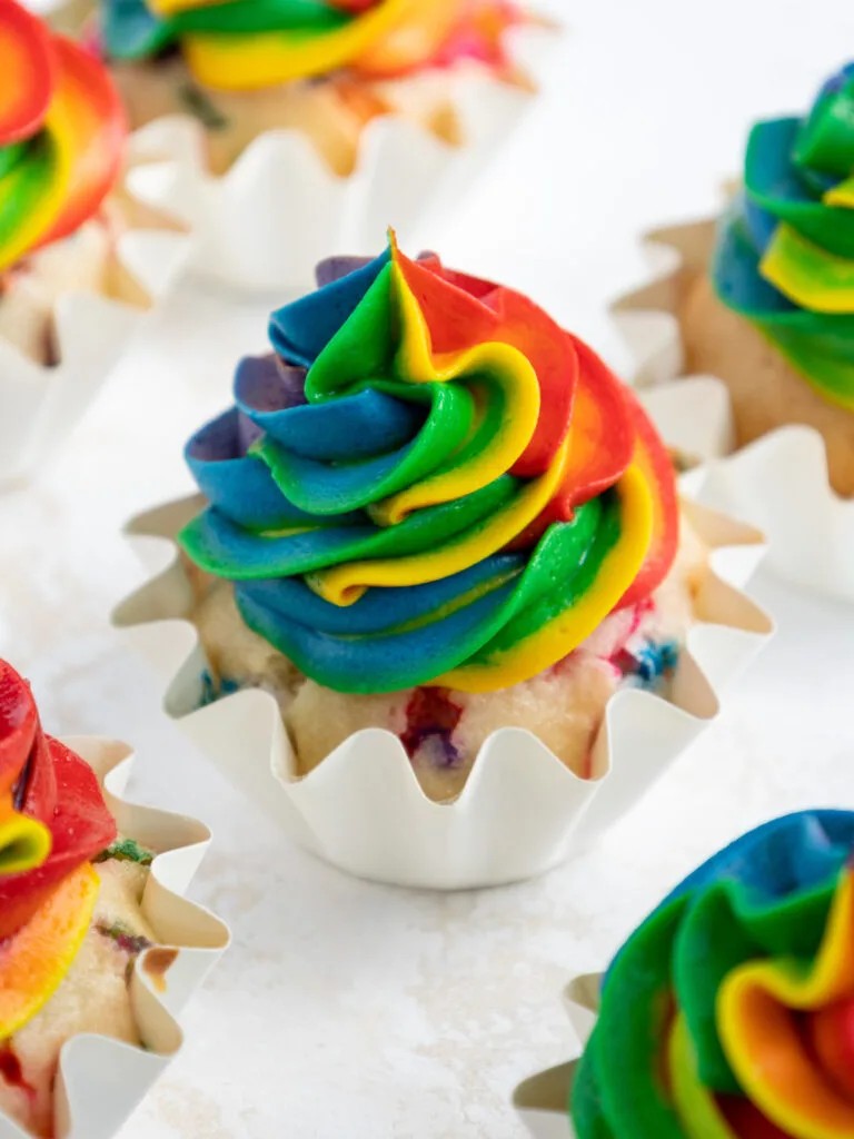 Rainbow frosting cupcakes