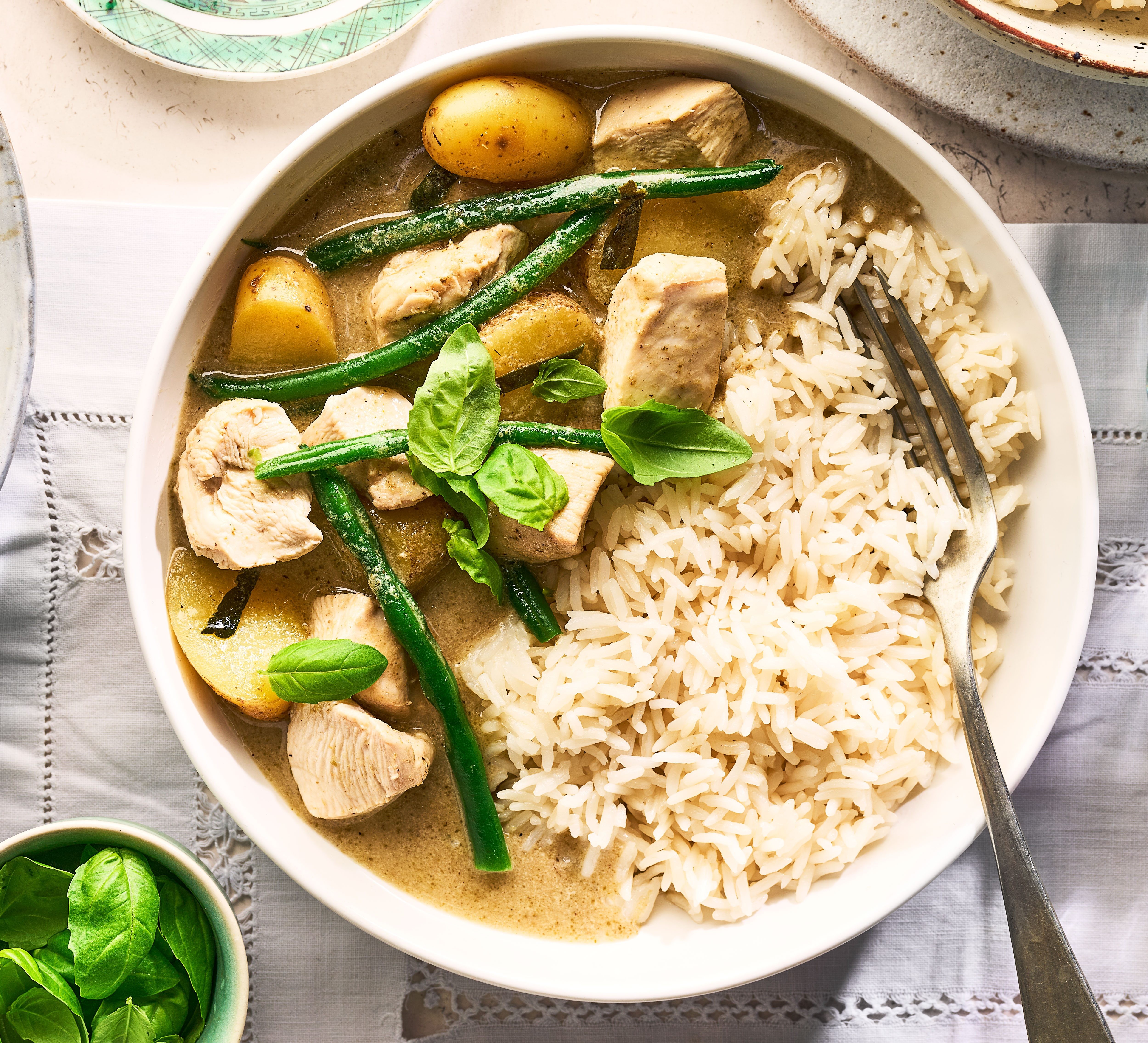 Thai green curry in bowl with rice
