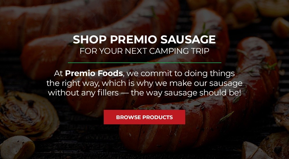 Assortment of foods suitable for camping, including bread, fruit, and snacks