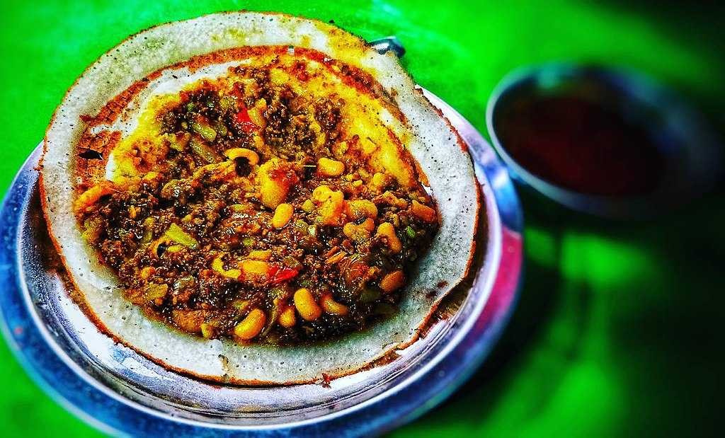 A plate of Nepali Chatamari, a Newari snack, referred to as the Nepali Pizza