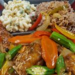 Jerk chicken with rice and beans, a popular Caribbean dish.