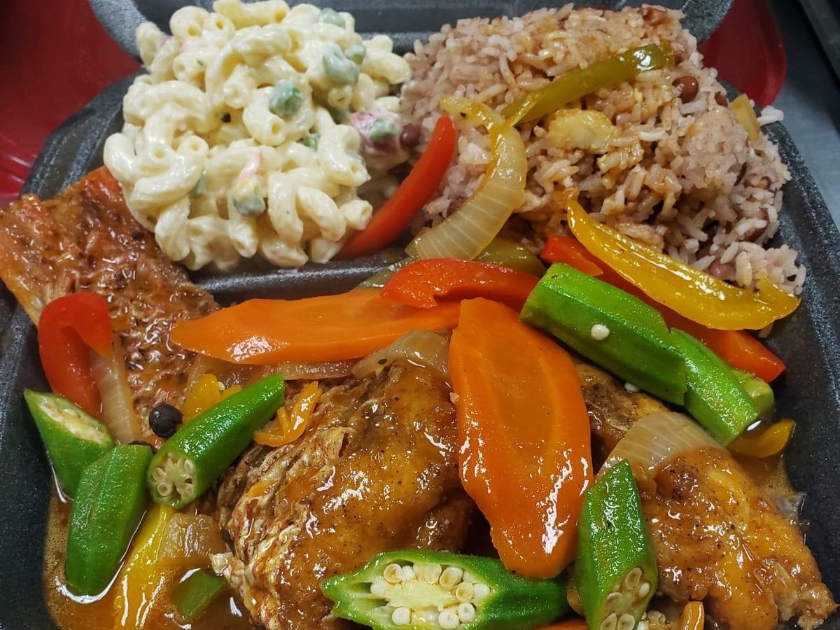Jerk chicken with rice and beans, a popular Caribbean dish.