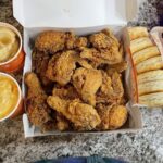 Popeyes 14-Piece Tender Family Meal served with two large sides and five biscuits