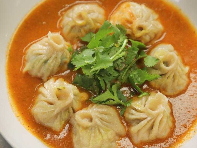 A close-up of flavorful momos, a popular Nepalese dumpling dish