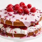 A close-up of fresh raspberries, contributing a vibrant pink hue to desserts and jams