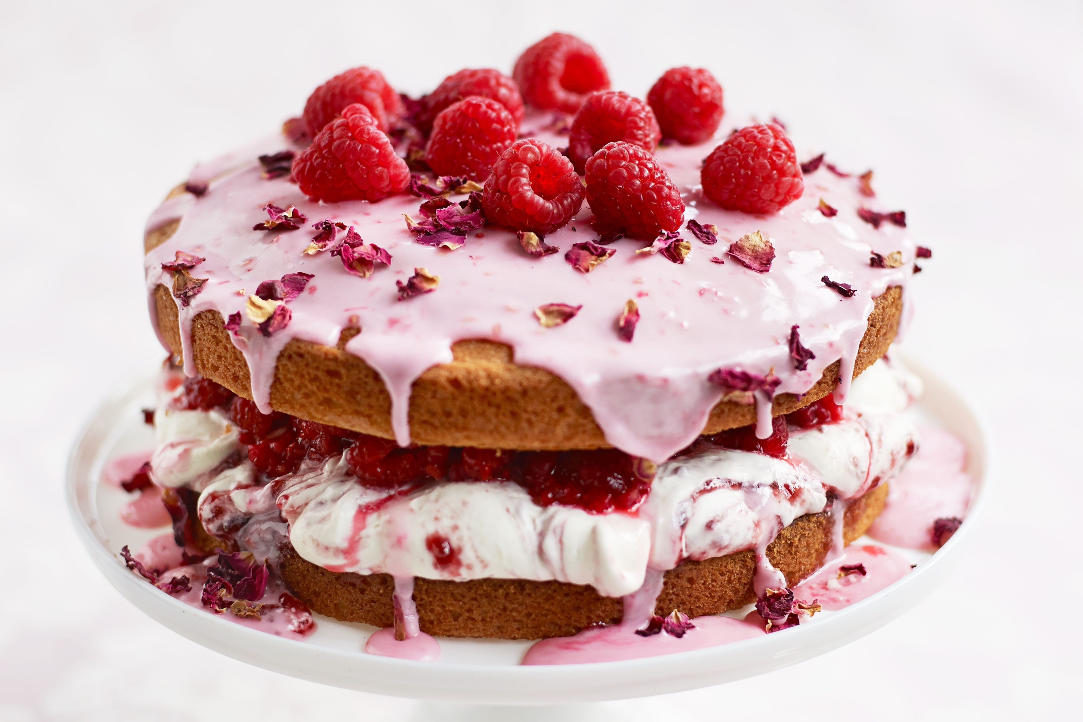 A close-up of fresh raspberries, contributing a vibrant pink hue to desserts and jams
