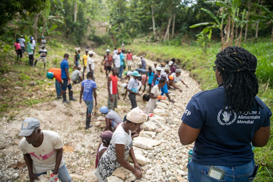 WFP staff overseeing a rehabilitation project in Haiti, promoting community resilience.