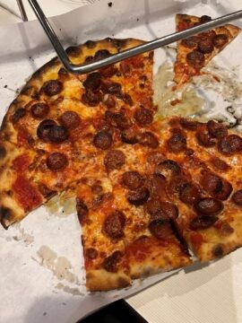 Frank Pepe's classic pepperoni pizza, perfectly charred and topped with fresh ingredients