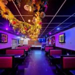 A vibrant outdoor dining scene in Lawrence KS, showcasing a variety of cuisines and a lively atmosphere