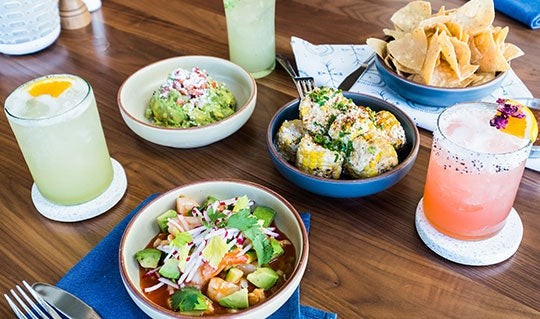 Blanco Tacos + Tequila dining area with vibrant decor and comfortable seating