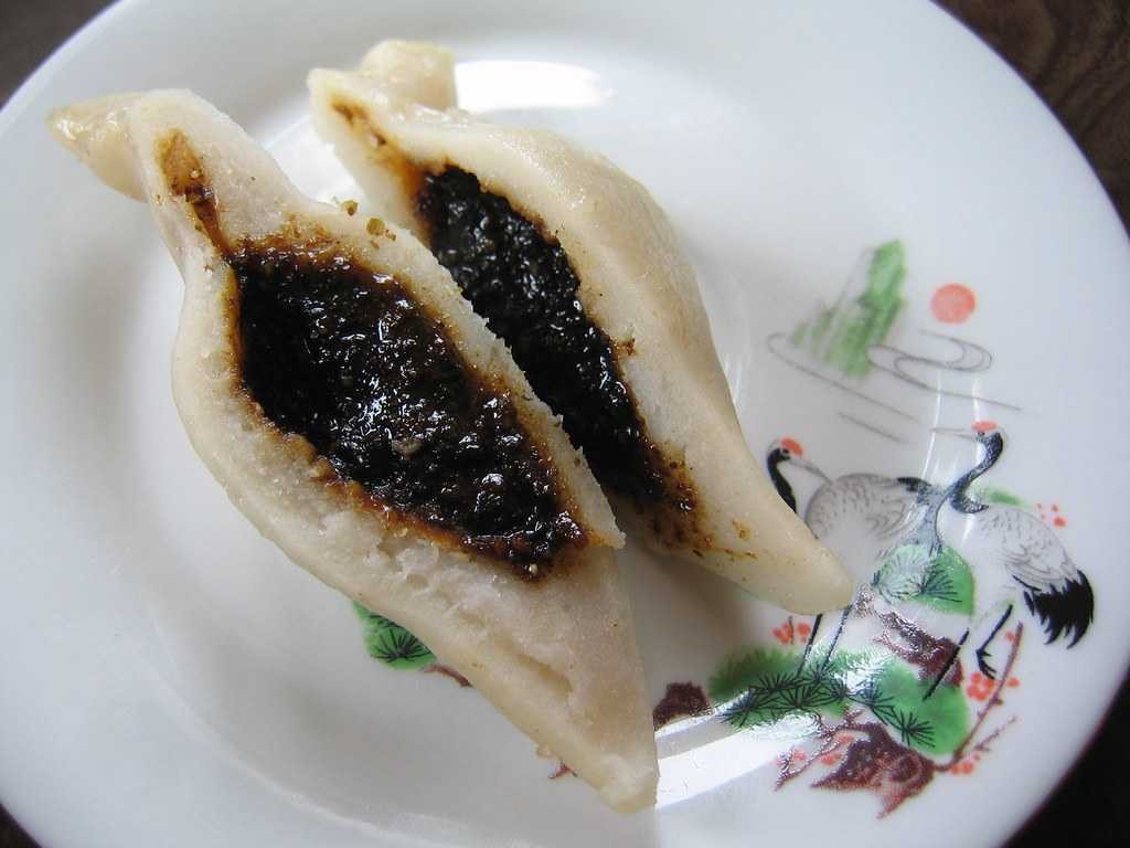 A close up of Yomari, a sweet dish prepared from rice dough, highlighting Nepal's culinary traditions