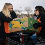 Volunteers loading food from mobile pantry