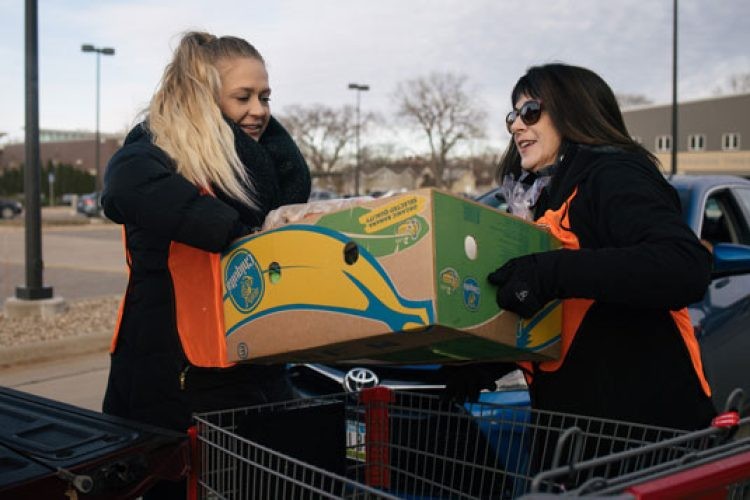 Volunteers loading food from mobile pantry