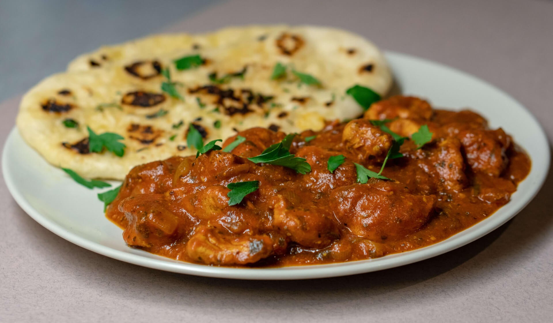 Chicken tikka masala with naan bread