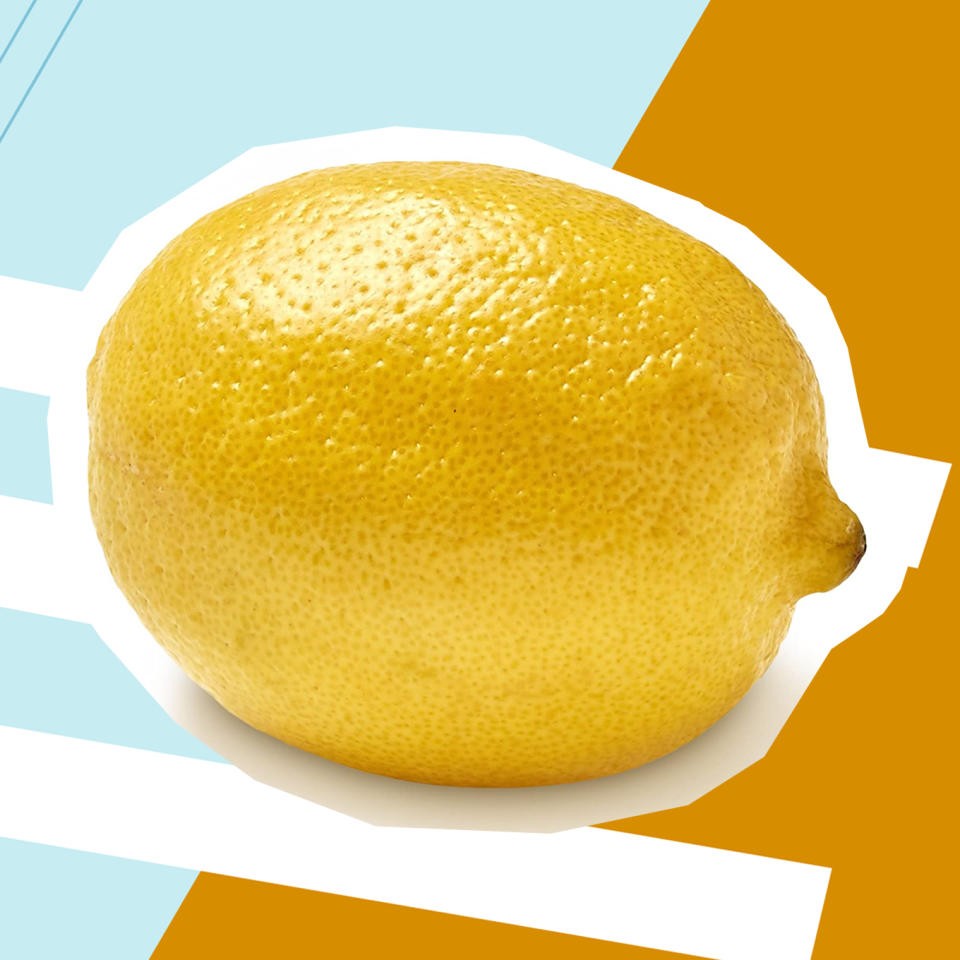 A sliced lemon, highlighting its vibrant yellow color and juicy texture, symbolizing the citrus fruits that can help improve semen taste.