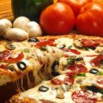 A side-by-side comparison of Italian and American pizza styles, highlighting differences in crust thickness, toppings, and overall presentation