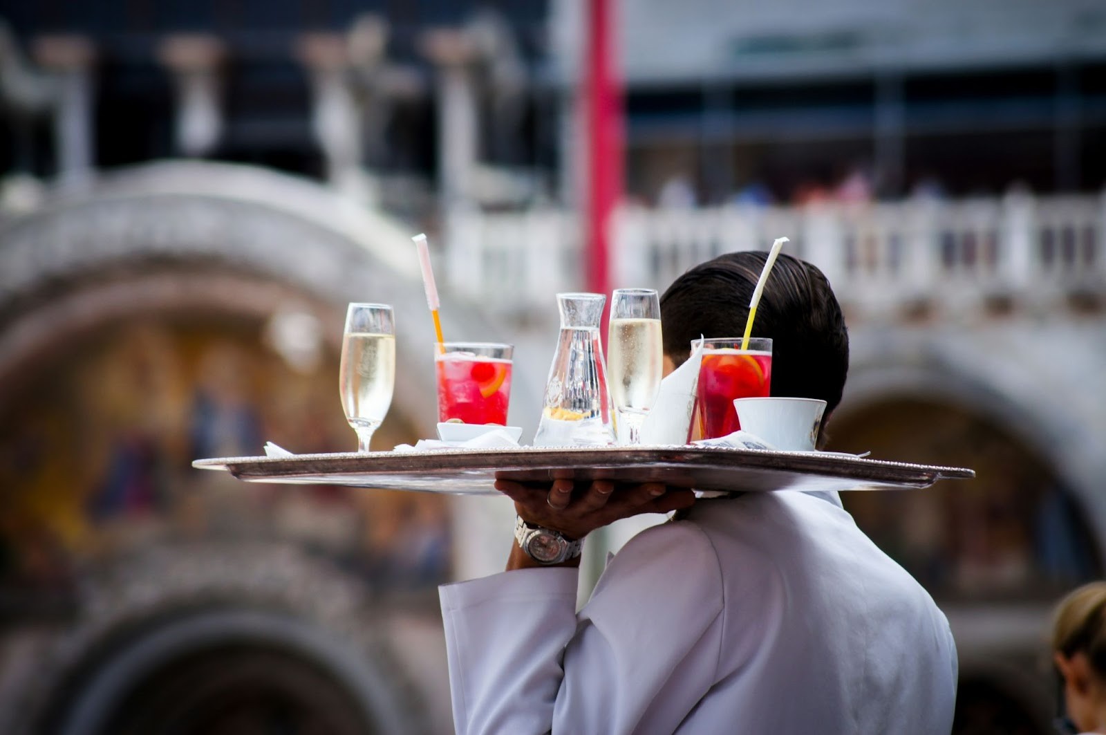 Food runner interacting with customer at restaurant